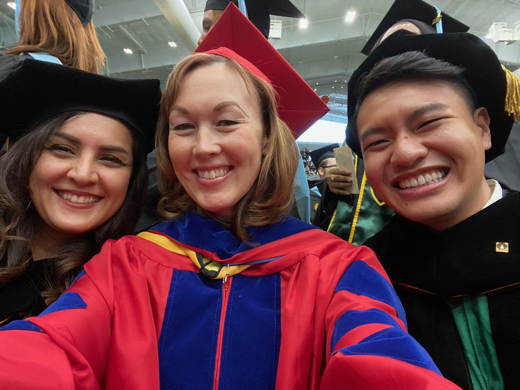 photo of Mallare with his advisor Rachael Dombrowski (center) and another doctoral graduate
