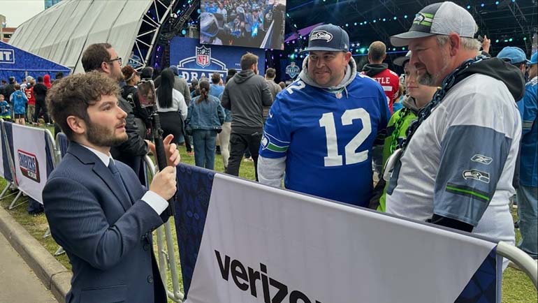 Ronnie Martin interviews Seattle Seahawks' fans at the 2024 NFL Draft in downtown Detroit in April.