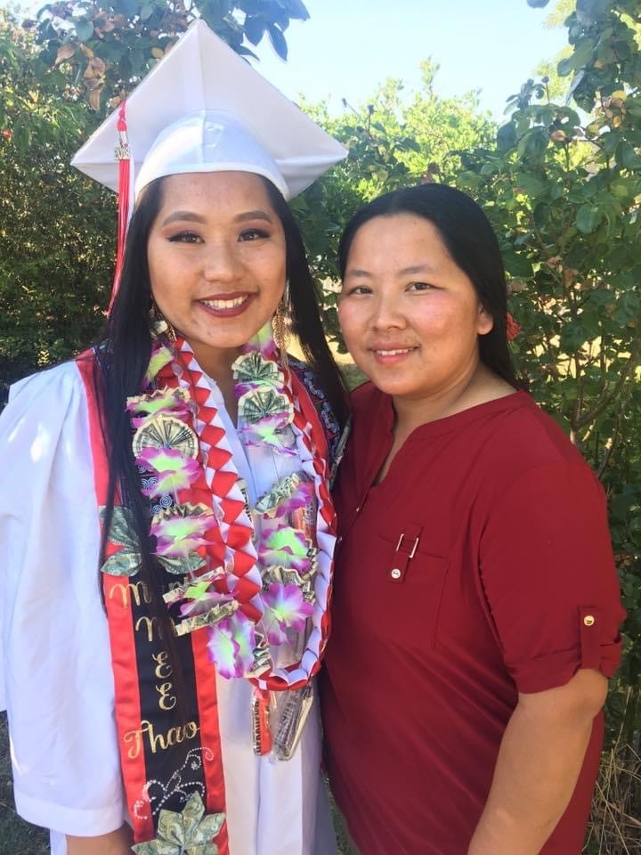 Mary Thao poses for a photo with her mother at her high school graduation.