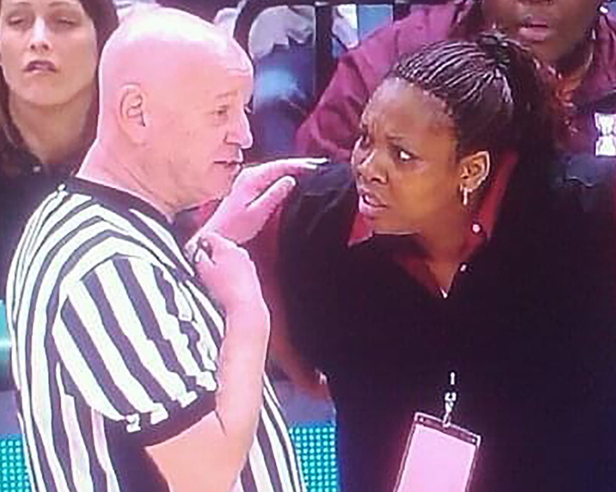 Referee Rick Massa gives an explanation to Inkster coach Peggy Carr during the Class A girls' basketball finals on March 19, 2011, at the Breslin Center in East Lansing. Inkster defeated Detroit Renaissance,, 43-37.