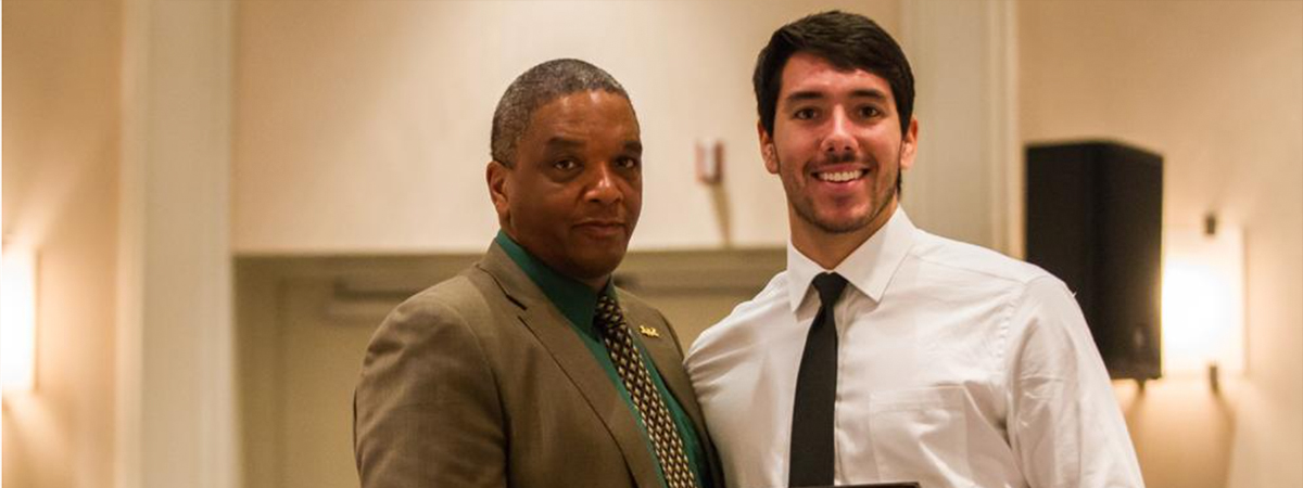 Manny Mendoza receives his scholar-athlete award from then WSU head coach Paul Winters at the football team banquet following the 2016 season. (Photo by Michael Dubicki)