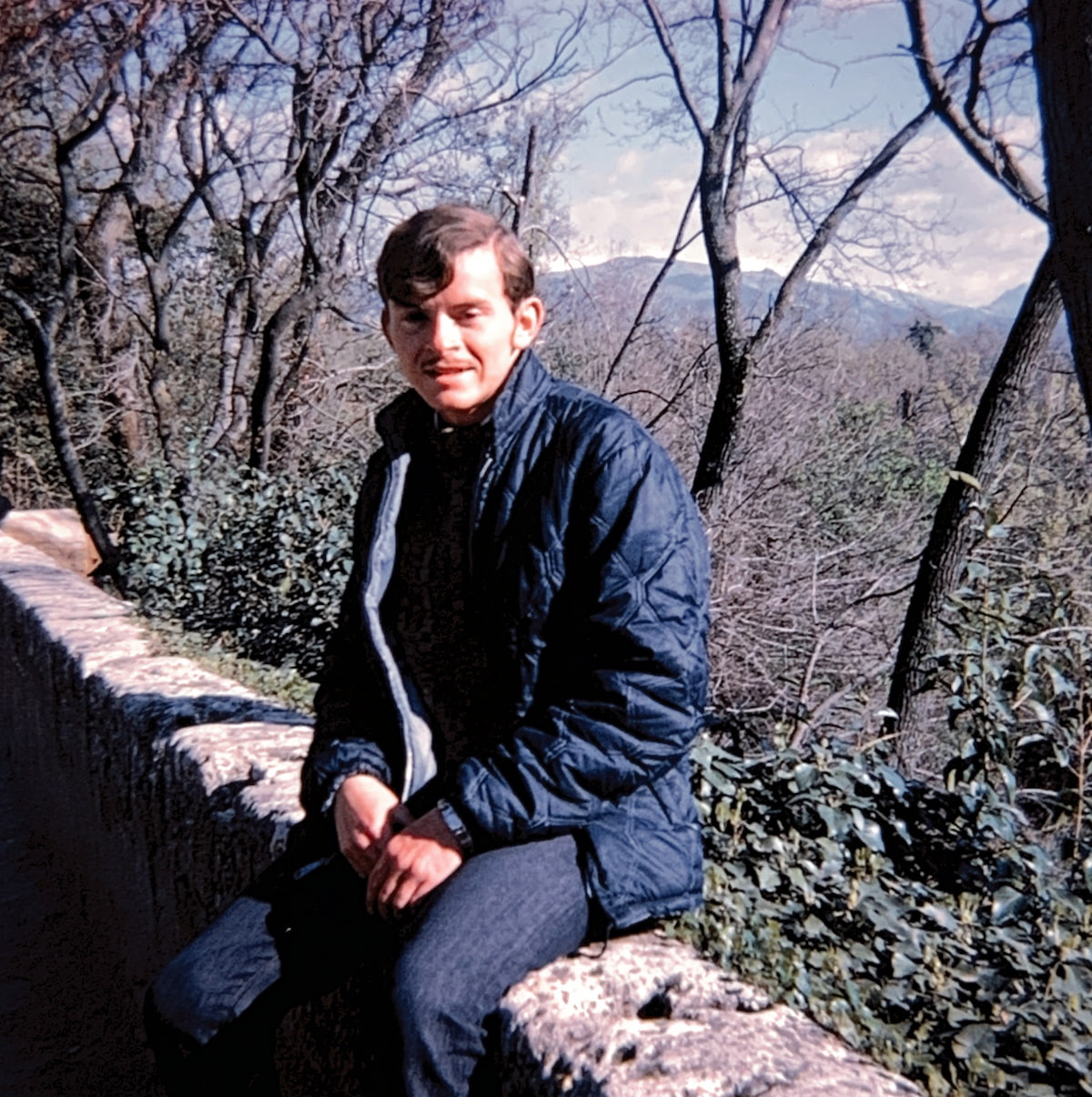 Mike sitting on a bench during his Junior Year in Munich Program
