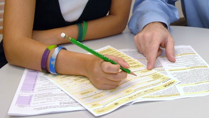 Student filling out paperwork
