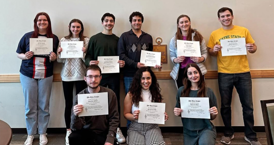 2024 Phi Beta Kappa luncheon participants holding awards