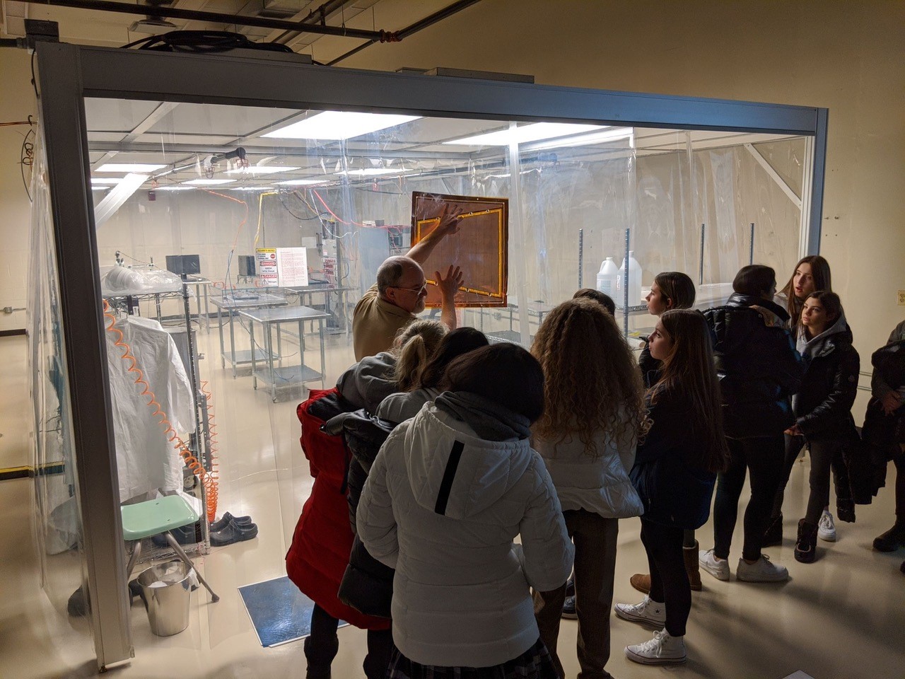 People touring the clean room lab