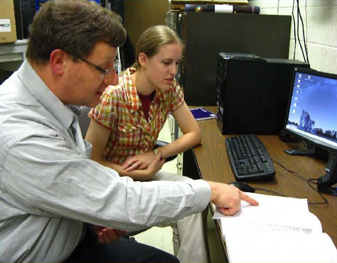 Professor Harr, and his student Erin, discuss topic will be the subject of a lecture by the analysis of a particle physics experiment