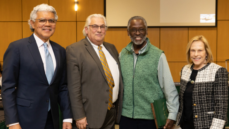 Ronald Brown (second from right) poses for a photo with Wayne State President M. Roy Wilson and two members of the Board of Governors.