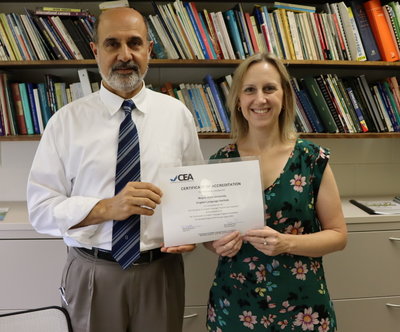 Dr. Bruce Morgan and ELI Lecturer Christi Laginess with ELI's accreditation