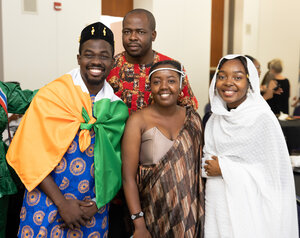 4 Mandela Fellows in traditional clothing