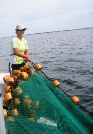 Sandy Camilleri pulling corks from the bow of the research vessel FLIP during a set.