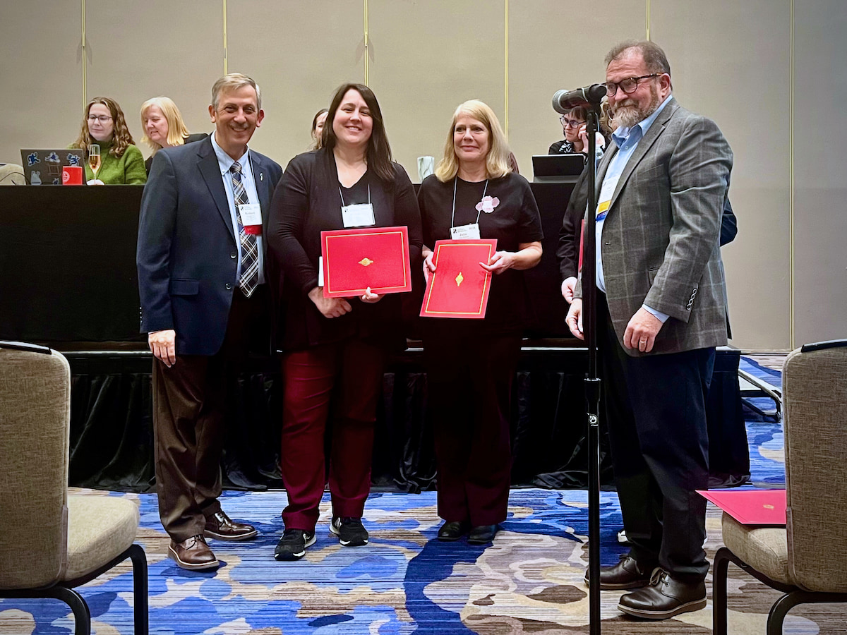 Anthropology graduate students Sarah Pounders (middle, left) and Julie Julison (middle, right) accept their awards for the Femme Beings Project Student Paper prize at the SHA conference in January 2025