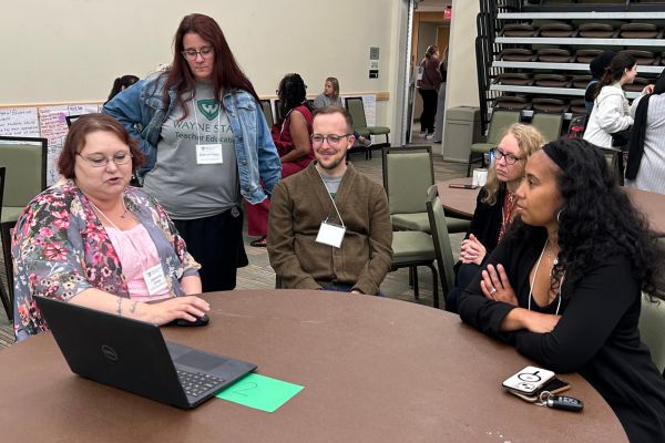 Group photo of SEED Pathways students engaged in discussion