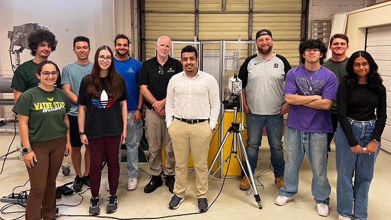 Hesham Aldhaibani (center) with classmates in Dr. Cameron Bass's lab in the College of Engineering.