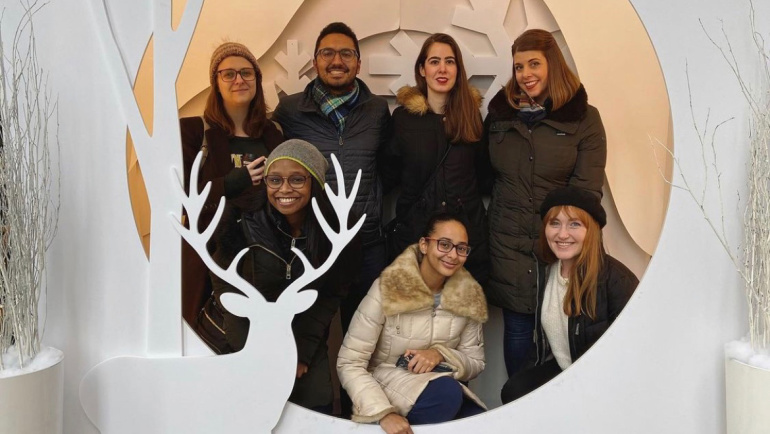 The Study Skills Academy staff poses for a photo behind a winter backdrop.