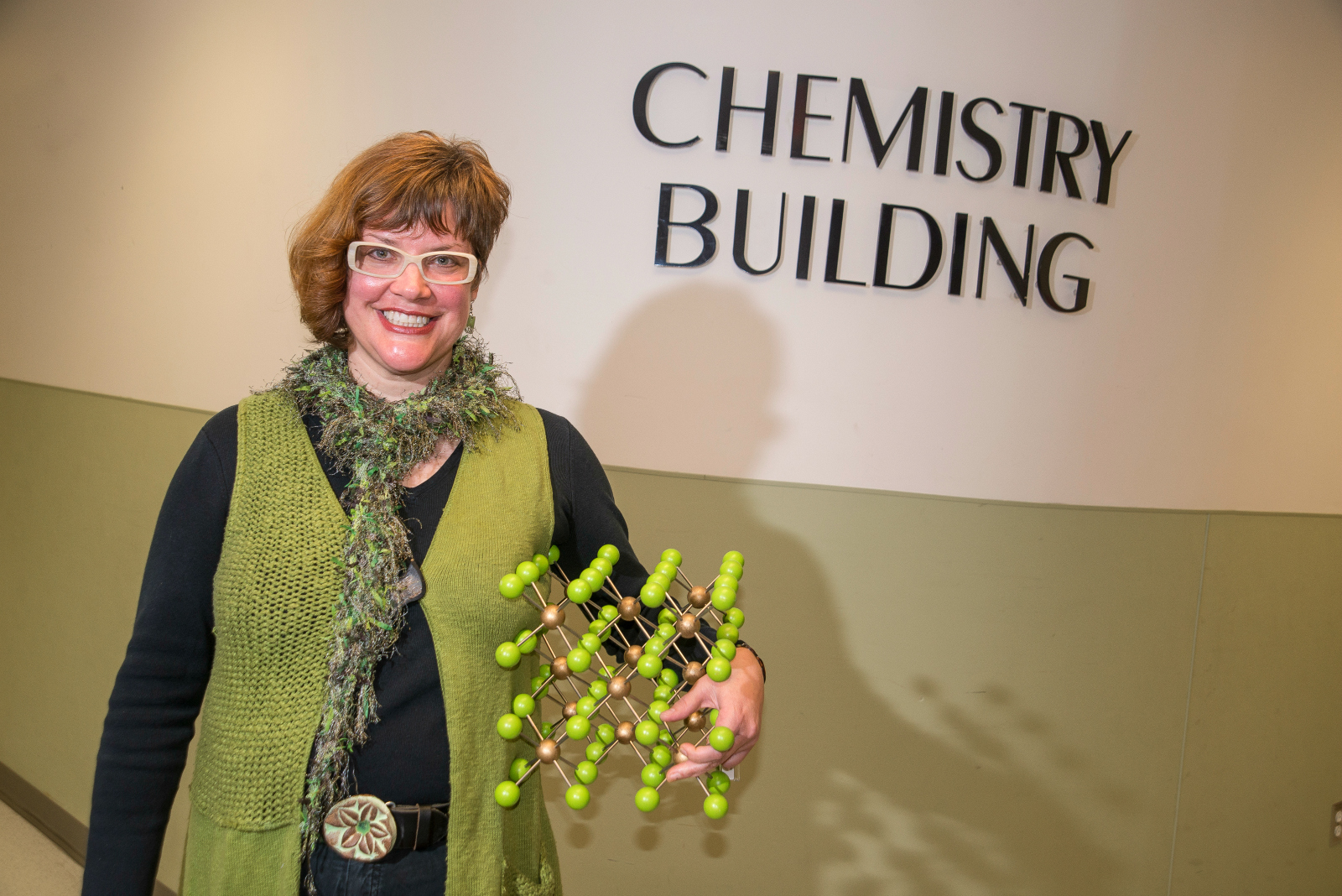 Stephanie Brock holding a chemical sculpture