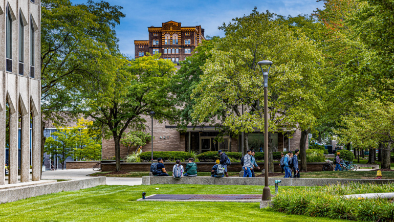 Students gather on Wayne State's campus on a beautiful summer day.