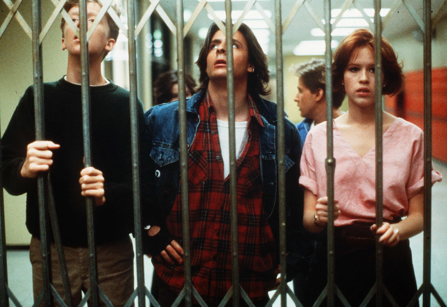 Characters in the Breakfast Club trapped behind a security gate