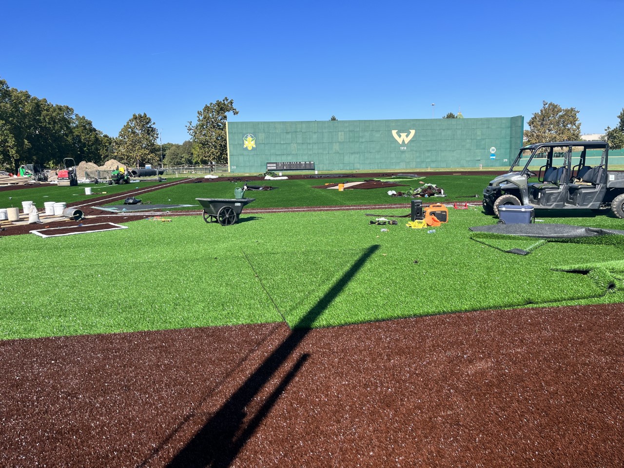 The new turf infield is installed at Harwell Field with equipment still on site.