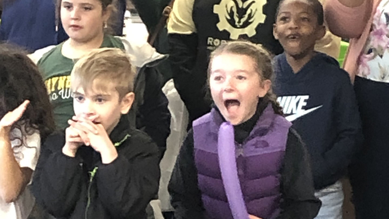 Elementary students react to Professor Kunzleman's demonstration during Bring Your Kids to Work Day at Wayne State University. 