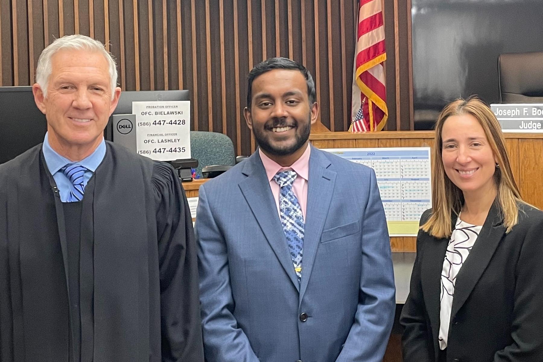 Muthu Veerappan posing with Judge Joseph F. Boedecker of the 39th District Court and Macomb County Assistant Prosecuting Attorney Jacqueline Gartin