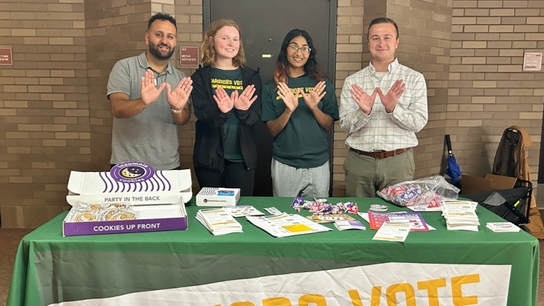 Students set up a table on Wayne State's campus to help others register to vote.