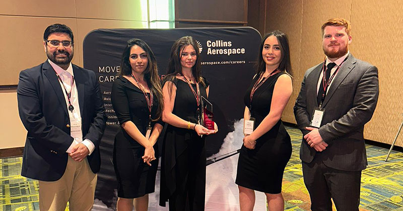 Photo of the Global Supply Chain undergraduate team members with award. Pictured are Mahin Fatima, Maya Halloun, Andrew Haselton and Warred Ayyad.