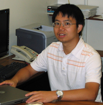 Photo of Wen Li at a computer.