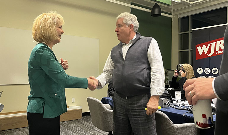 President Kimberly Andrews Espy, Ph.D., meets morning talk show host Guy Gordon during WJR's live broadcast from Wayne State on Oct. 23, 2023.