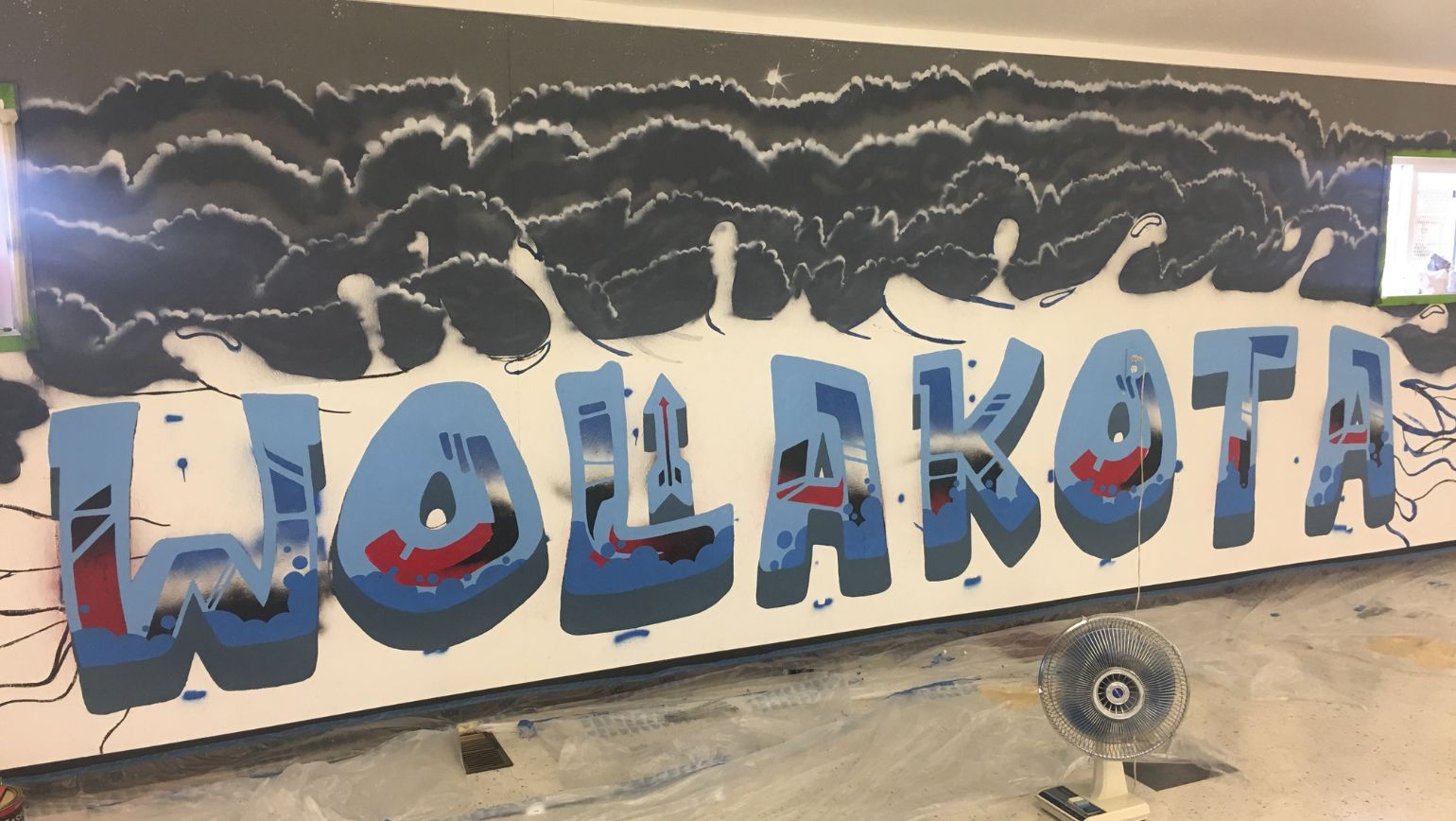 painted mural that reads wolakota