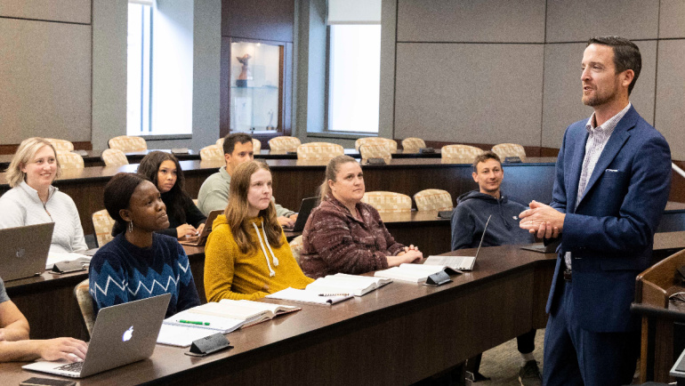 A Wayne State University professor delivers a lecture to a classroom of attentive students.