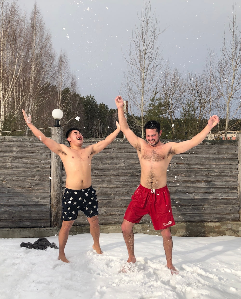 Students outside in the snow with their clothes off