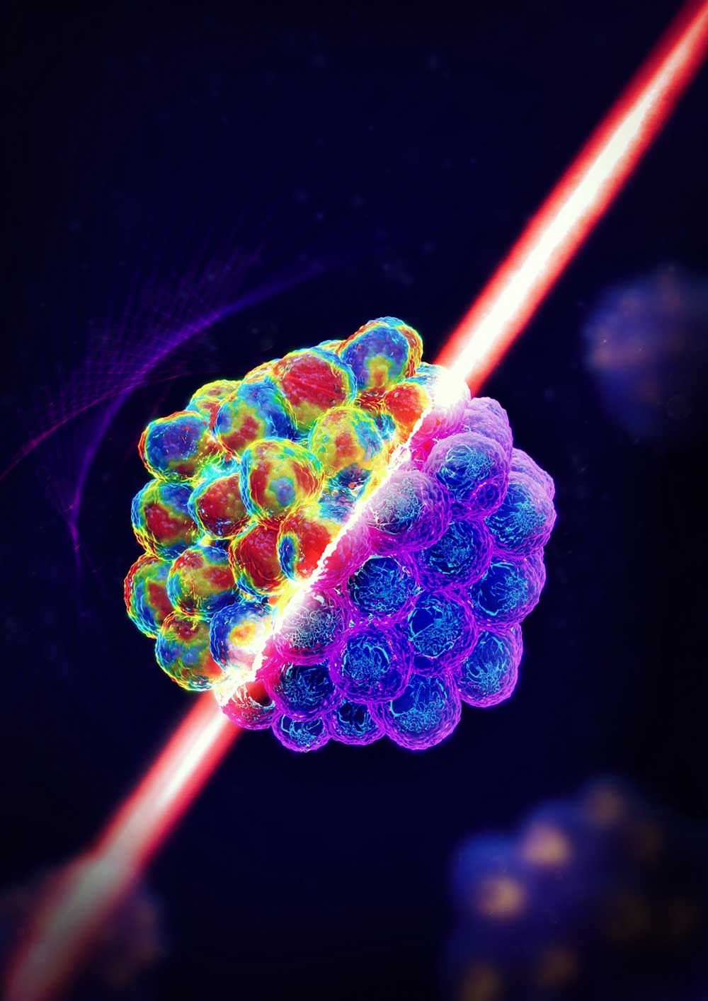 Depiction of laser beam traveling through tumor spheroids