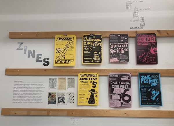 Two rows of flyers hang in the Chattanooga Public Library's Zine Library and Lab.